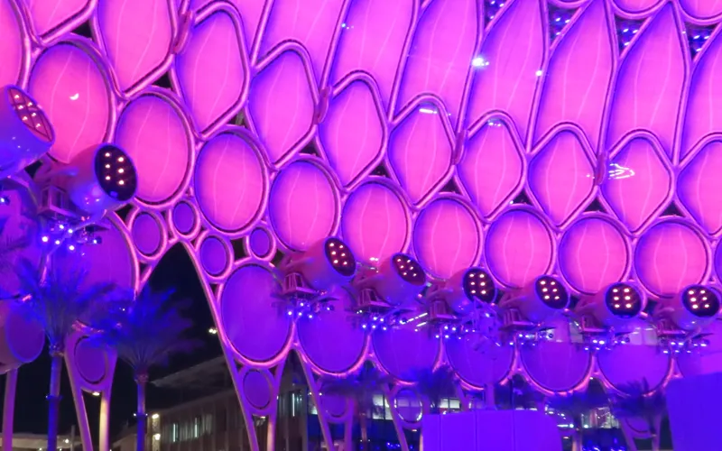 Al Wasl Plaza dome at Expo 2020 Dubai, lit purple at night (cropped to exclude crowd)